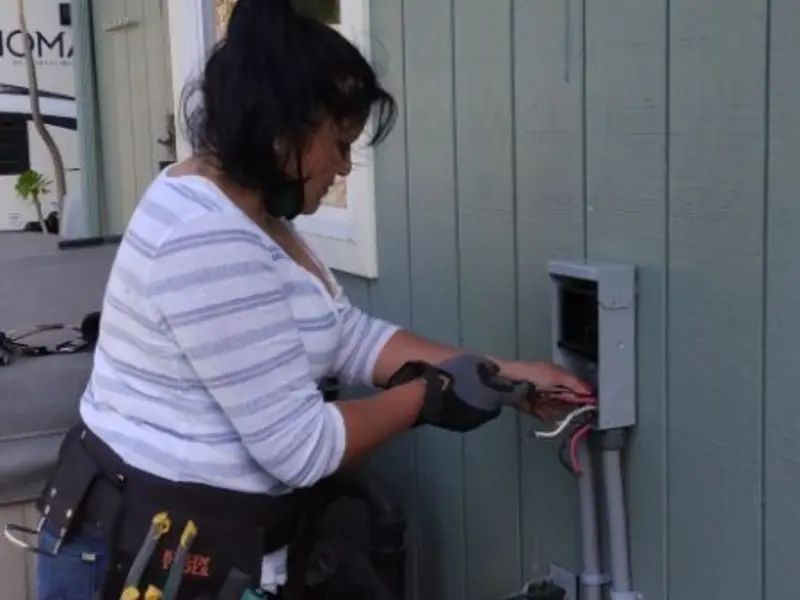 Licensed electrician wiring an exterior subpanel in Chestnut Ridge